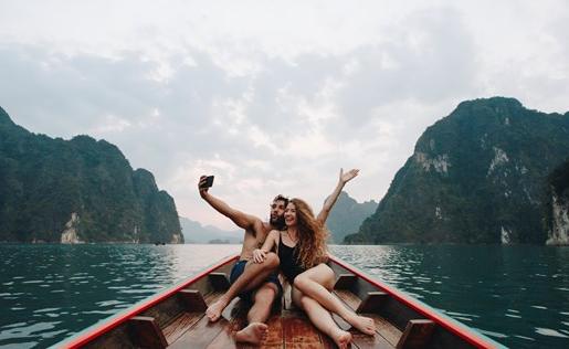 Friends on a boat in a remote part of the world